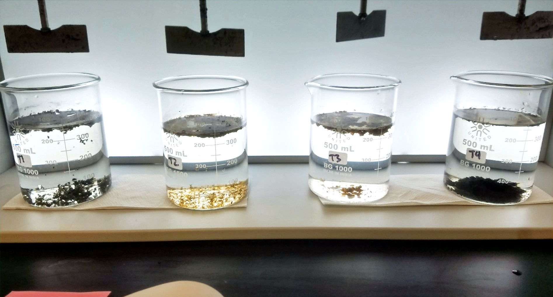 Laboratory jars used to compare polymer flocculation